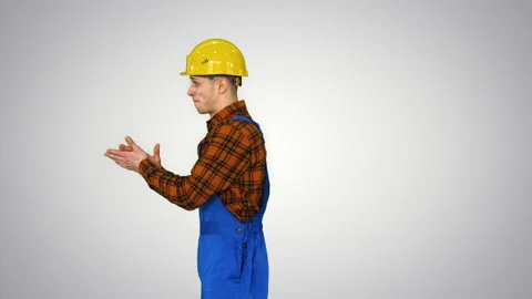 Construction worker making a flip and folds hands looking to camera The best Stock-Footage 130704717
