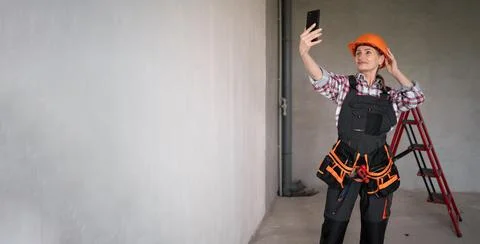 Construction worker making selfie portrait in apartment for renovation. civil Stock Photos
