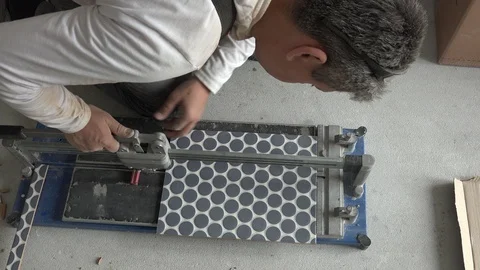 Construction worker man work with floor tile cutting equipment Stock Footage 113495040