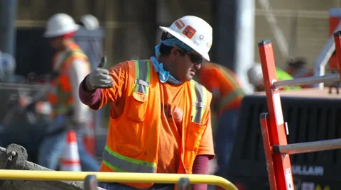 Construction worker manages the stream from concrete mixer truck 動画素材 34570674