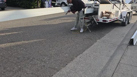 Construction worker manufacturing new rain gutters Stock Footage 247781804