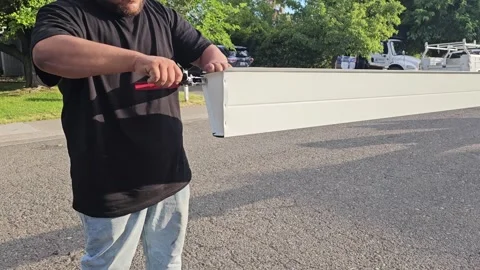 Construction worker manufacturing new rain gutters Stock Footage 247781826