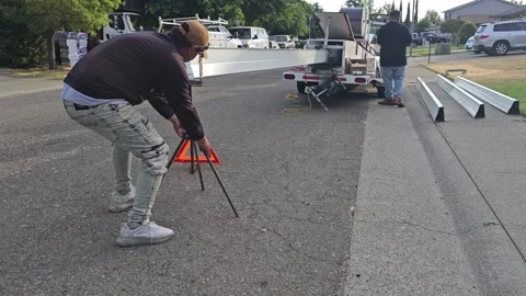 Construction worker manufacturing new rain gutters, extruding Stock Footage 247781904
