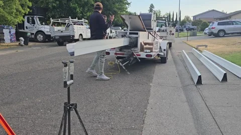 Construction worker manufacturing new rain gutters Stock Footage 247781935