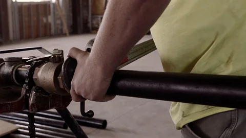 A Construction Worker Measures A Pipe And Marks It 스톡 동영상 87482998