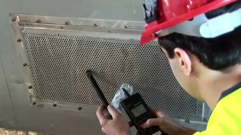 Construction worker measuring air quality in ventilator shaft Stock Footage 69128998