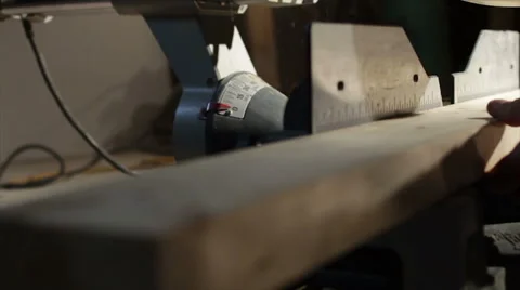 Construction Worker Measuring and Cutting 2x4 with Mitre Saw Stock Footage 40647163