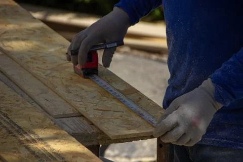 Construction worker measuring Stock Photos