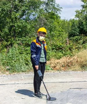 Construction worker with metal detector Stock Photos