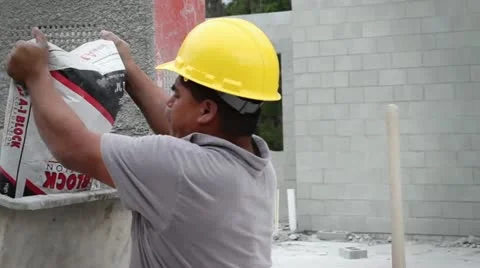 Construction Worker Mixes Cement concrete mixer Video stock 21111482