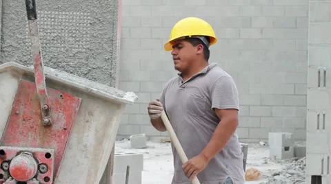 Construction Worker Mixes Cement on Job Site Video stock 21110909