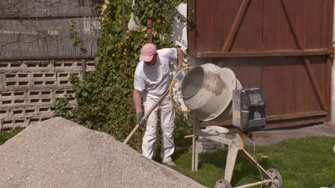 Construction worker mixing concrete Stock Footage 99873019