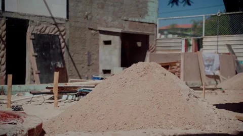 Construction worker mixing sand plaster with a shovel Stock Footage 342111449