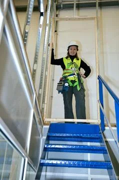 Construction worker mounting plasterboard on building site Stock Photos
