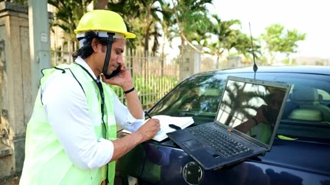 Construction worker multitasking with phone Stock Footage 277036499