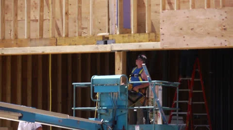Construction worker with nail gun Stock Footage 23115113