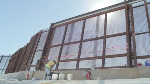 Construction Worker Near Border Fence Stock Footage 60387147