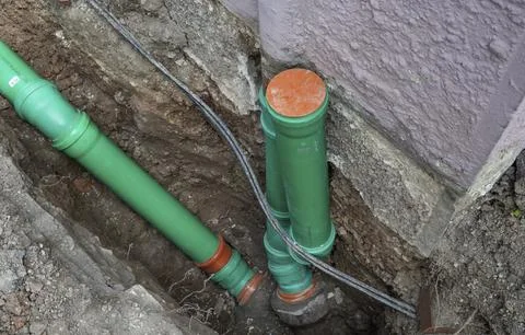 Construction worker, newly laid green sewage pipes, Stuttgart, Stock Photos