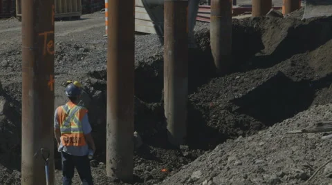 Construction worker observing excavator Stock Footage 65053011