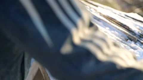 Construction worker in old uniform bends construction iron fittings. Winter Stock Footage 102598060