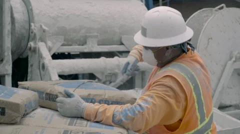 Construction worker Opening Bag of Cement - Super Slow Motion 240FPS Stock Footage 63372339