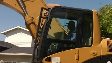 Construction worker operates a caterpillar Stock Footage 66520221