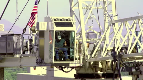 A construction worker operates a crane high above Salt Lake City Video stock 52326830