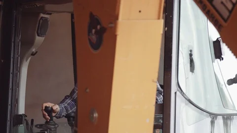 A Construction Worker Operates An Excavator Stock Footage 87481976