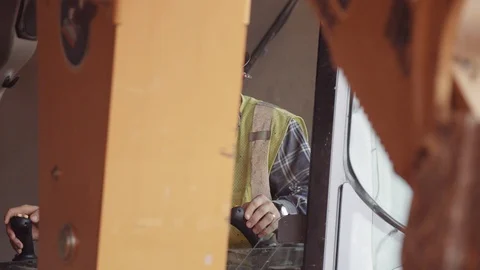 A Construction Worker Operates An Excavator Stock Footage 87482036