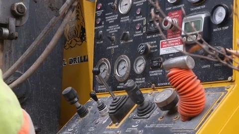 Construction worker operates well drilling controls close Stock Footage 77278335
