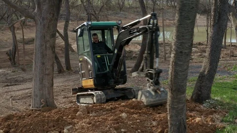 Construction Worker Operating an Excavator Stock Footage 106258136