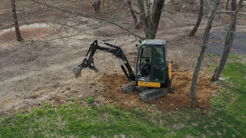 Construction Worker Operating an Excavator Stock Footage 106260329