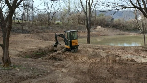 Construction Worker Operating an Excavator Stock Footage 106260609