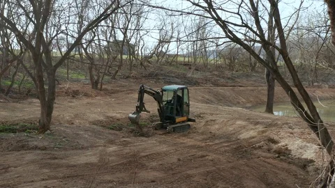 Construction Worker Operating an Excavator Stock Footage 106260756