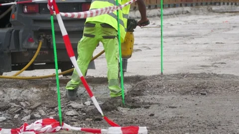 Construction Worker Operating Jackhammer During Road Demolition Stock Footage 344437351