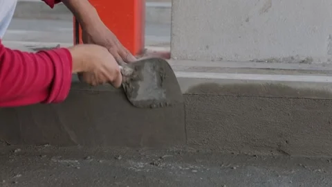 Construction worker or mason laying bricks and creating walls border Stock Footage 148272531
