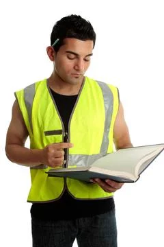 Construction worker or student Construction worker with a book or a constr... Stock Photos