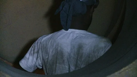 Construction worker or welder climbing through metal work and pipes 3 Stock Footage 123721127