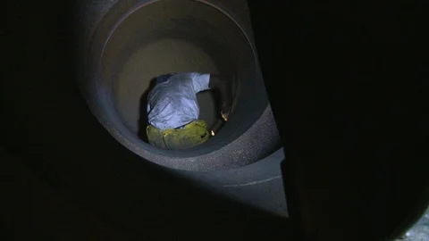 Construction worker or welder climbing through metal work and pipes 2 Stock Footage 123721150