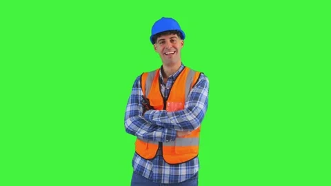 Construction worker with orange vest and safety helmet crossing arms and sm.. Stock Footage 286985612