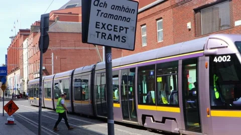 Construction worker by passing train in city centre Stock Footage 132825018