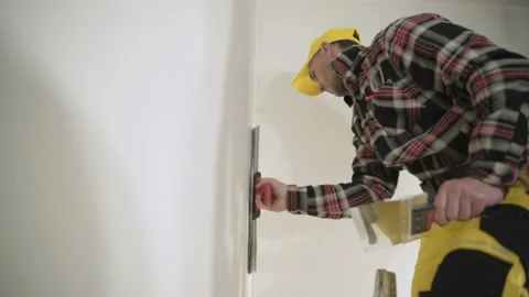 Construction Worker Patching Apartment Walls Vídeos de archivo 154773868