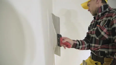 Construction Worker Patching Bathroom Ceiling Vídeos de archivo 154774116