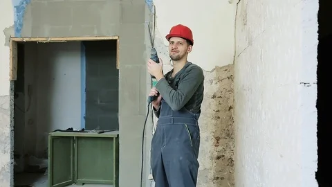 Construction worker with perforator Stock Footage 106259756