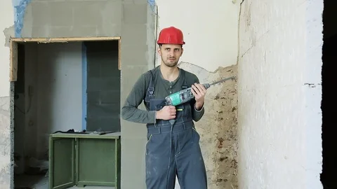 Construction worker with perforator Stock Footage 106259911