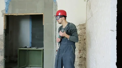 Construction worker with perforator Stock Footage 106260279