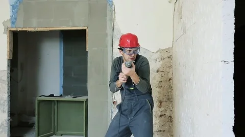 Construction worker with perforator Stock Footage 106260553