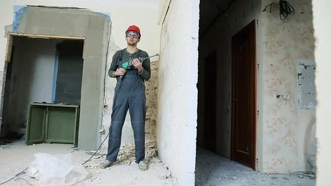 Construction worker with perforator Stock Footage 106260842