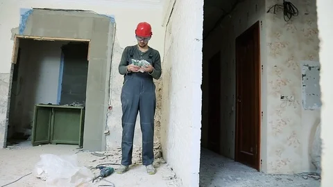 Construction worker with perforator Stock Footage 106261209