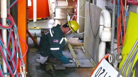 Construction worker performing cutting and grinding work. Stock Footage 81822472